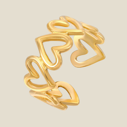 Anillo de corazones dorados para mujer. Diseño moderno, romántico y ajustable. Perfecto como regalo o para añadir un toque dulce al look.